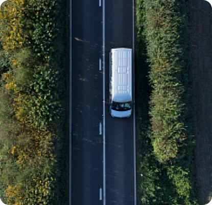 ariel view of delivery van driving on the road
