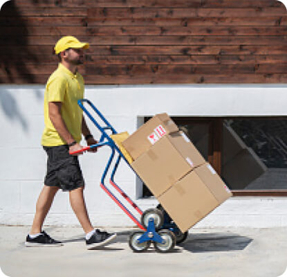delivery person delivering boxes to business