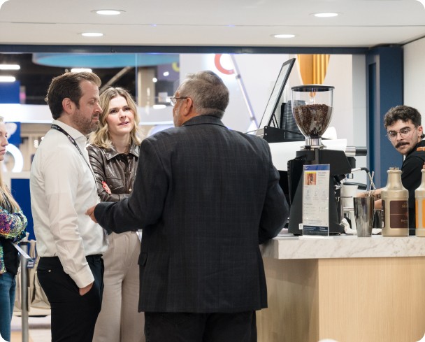 Rina Hurst sitting on a chair smiling