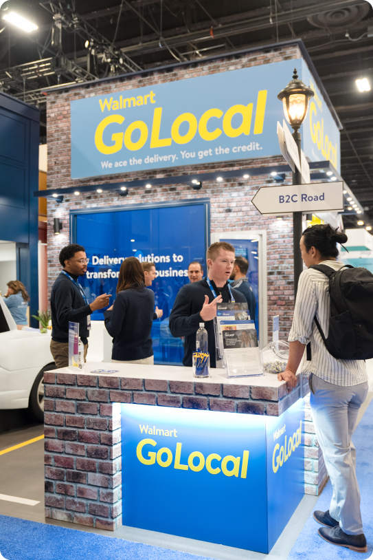 Walmart GoLocal trade show and event booth staffed with last-mile delivery experts.
